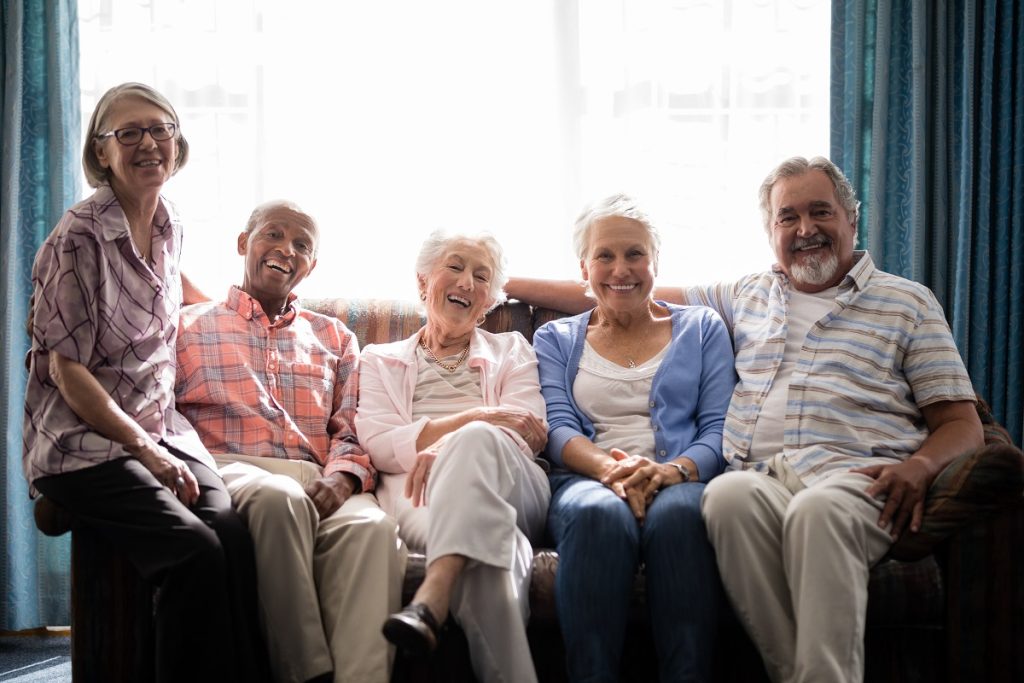 A group of seniors smiling to the camera